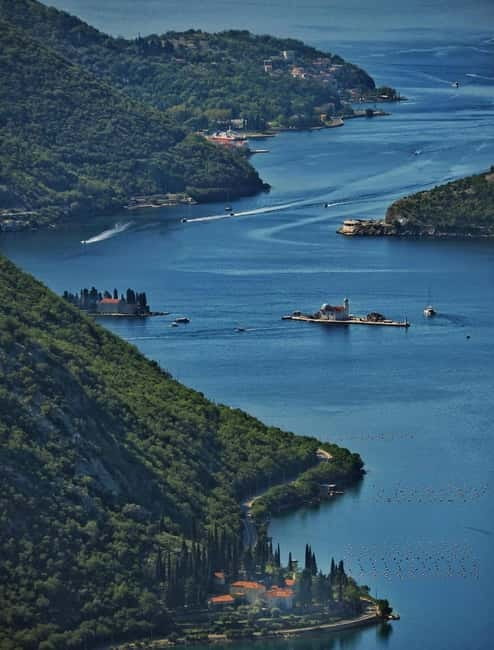 Kotor: Private Blue Cave & Bay of Kotor Boat Tour w/ Drink - Perast from the water and Our Lady of the Rocks
