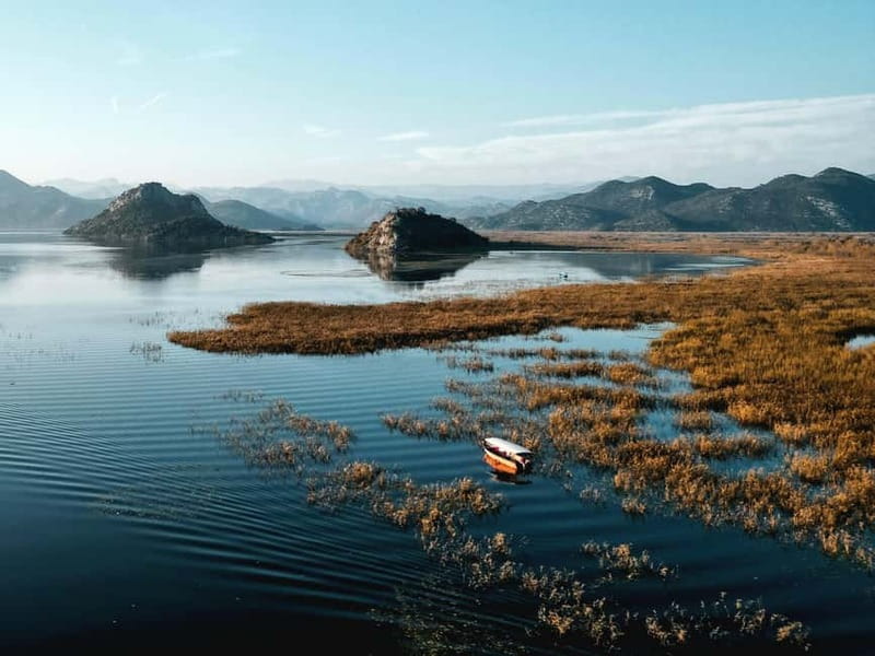 Skadar Lake: Guided Sunset Boat Tour with Wooden Boat & Wine - Wine, views, and a pause at Kamenik