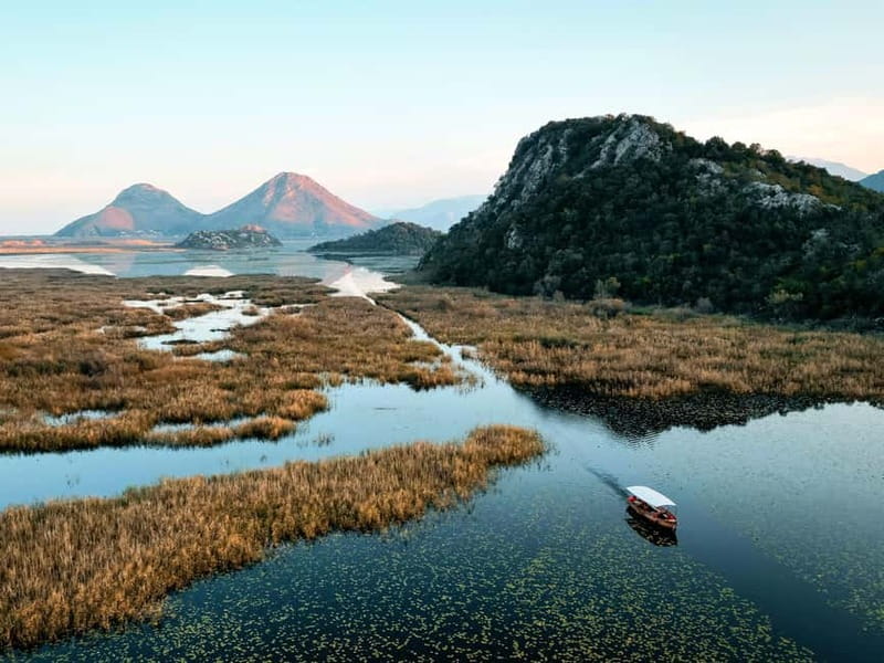 Skadar Lake: Guided Sunset Boat Tour with Wooden Boat & Wine - The ten-minute swimming stop